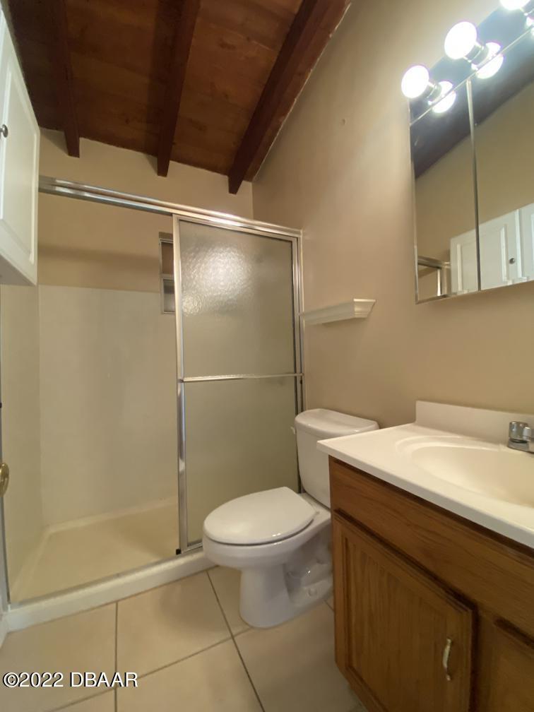 114 Essex Drive Ormond Beach, FL 32176 - Photo 19 of 21 a bathroom with a granite countertop sink toilet and shower