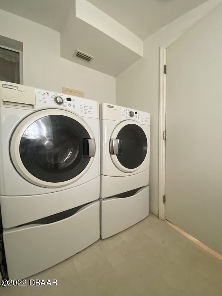 114 Essex Drive Ormond Beach, FL 32176 - Photo 21 of 21 a utility room with dryer and washer