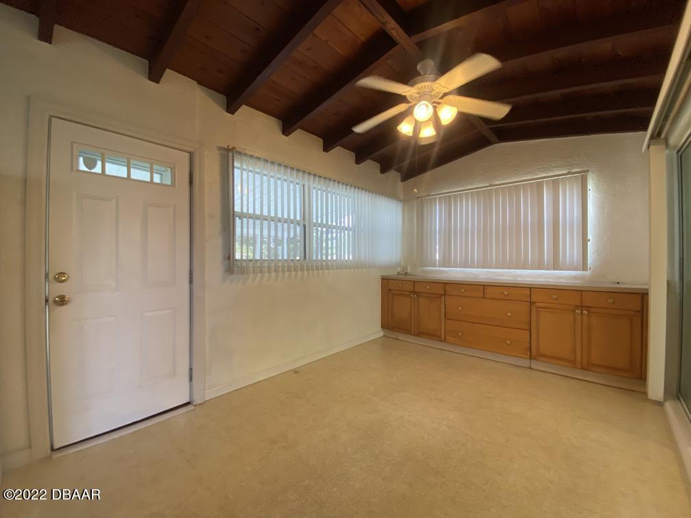 114 Essex Drive Ormond Beach, FL 32176 - Photo 4 of 21 wooden floor in an empty room with a window