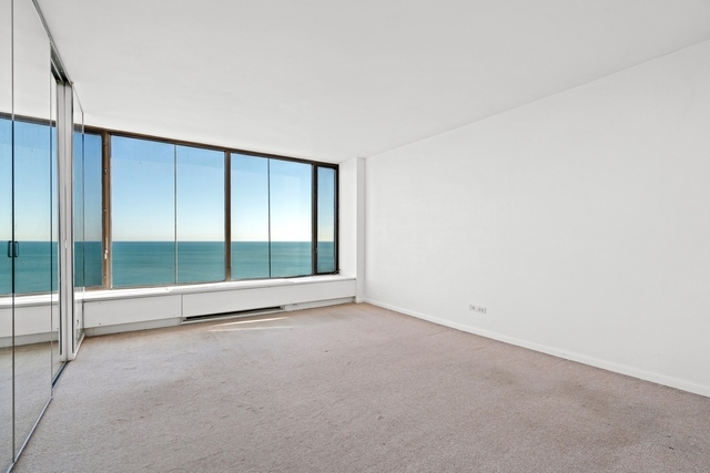 5455 North Sheridan Road, Unit 2301 Chicago, IL 60640 - Photo 12 of 18 a view of an empty room with a window