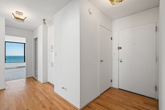 5455 North Sheridan Road, Unit 2301 Chicago, IL 60640 - Photo 14 of 18 a view of hallway with wooden floor