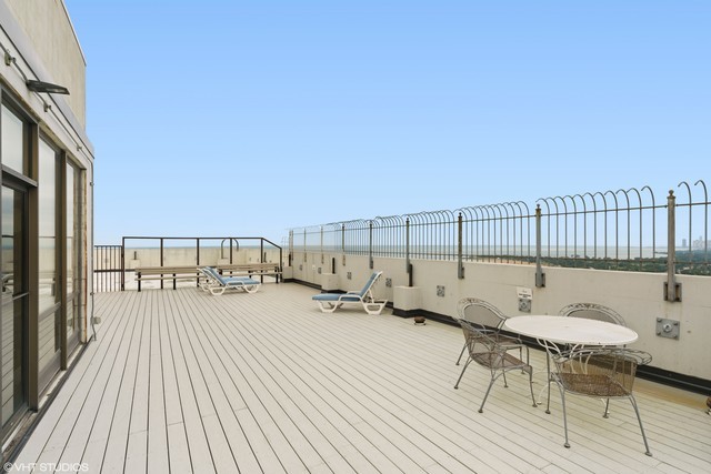 5455 North Sheridan Road, Unit 2301 Chicago, IL 60640 - Photo 18 of 18 a terrace with outdoor seating