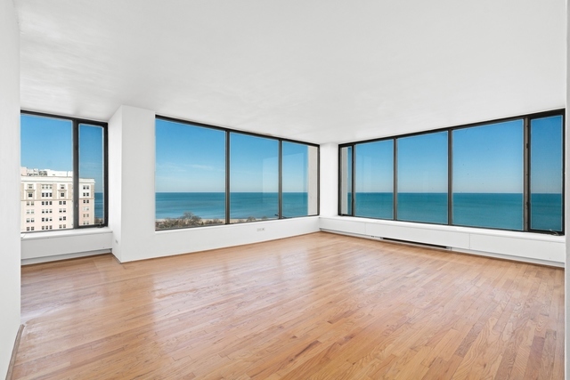 5455 North Sheridan Road, Unit 2301 Chicago, IL 60640 - Photo 2 of 18 a view of an empty room with wooden floor and a window