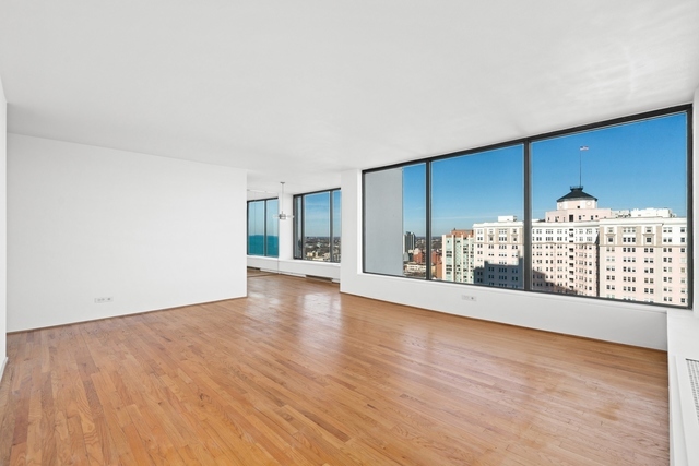 5455 North Sheridan Road, Unit 2301 Chicago, IL 60640 - Photo 3 of 18 wooden floor in an empty room with a window