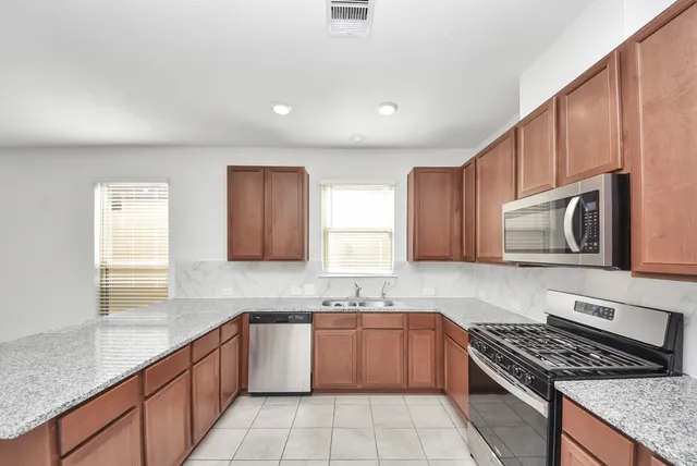 a kitchen with sink and window