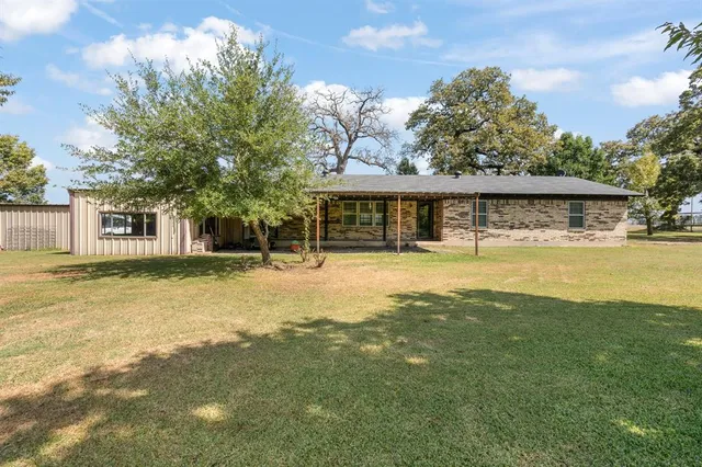 a view of a green field with clear sky