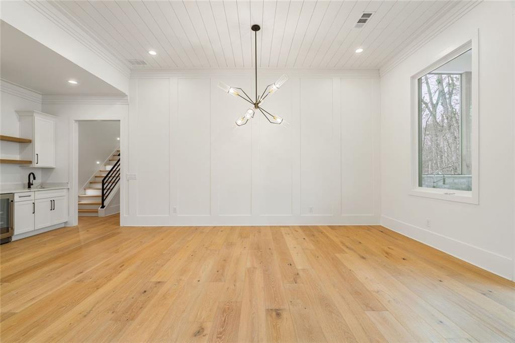 555 Lower Birmingham Road Canton, GA 30115 - Photo 41 of 104 a view of a room with wooden floor and a ceiling fan