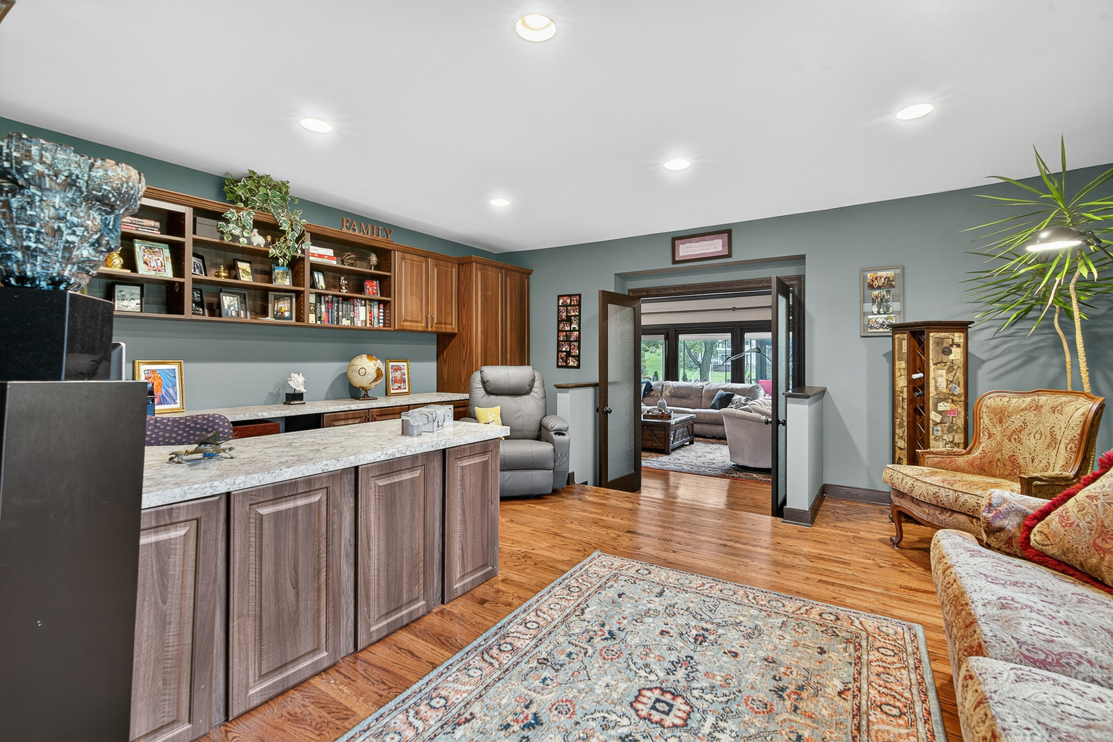1886 West Clover Drive Inverness, IL 60067 - Photo 12 of 45 a living room with stainless steel appliances granite countertop furniture rug and wooden floor