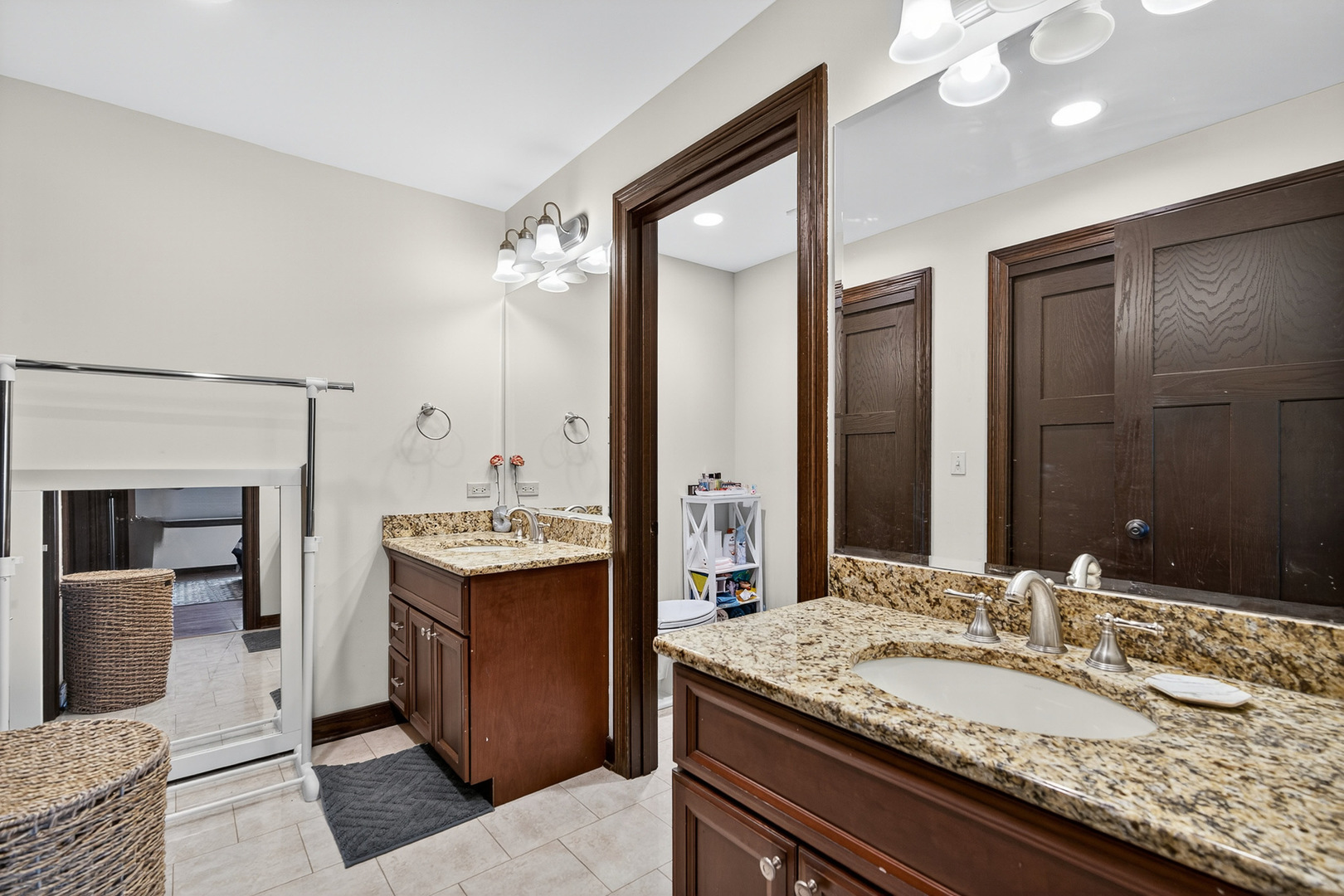 1886 West Clover Drive Inverness, IL 60067 - Photo 26 of 45 a bathroom with a granite countertop sink and a mirror
