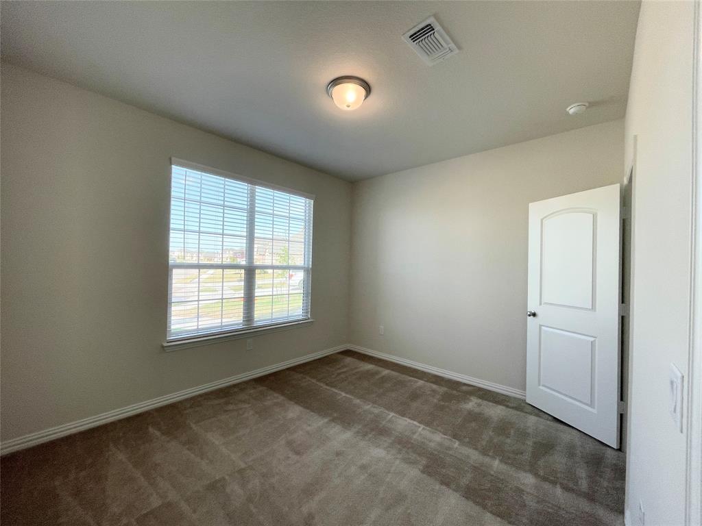 1805 Nelson Street Anna, TX 75409 - Photo 19 of 38 an empty room with a window