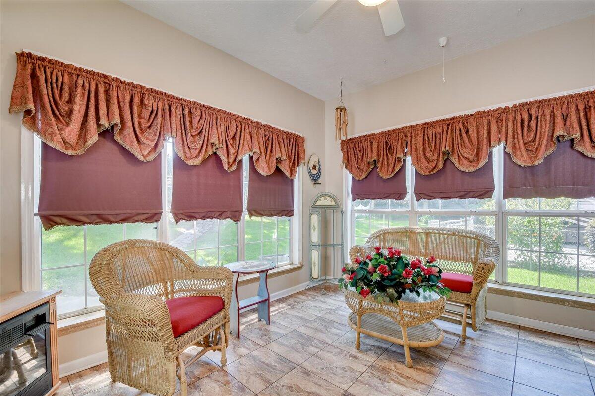 2008 Gregory Lake Road North Augusta, SC 29860 - Photo 14 of 56 Sunroom - lots of windows and view of the beautifully landscaped back yard.