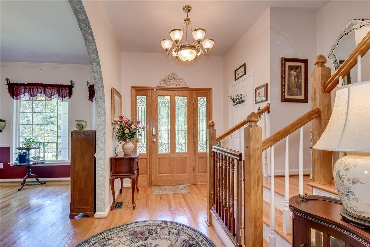 2008 Gregory Lake Road North Augusta, SC 29860 - Photo 3 of 56 Grand entrance - arched opening frames the formal dining - stairs lead to 2 bedrooms upstairs.
