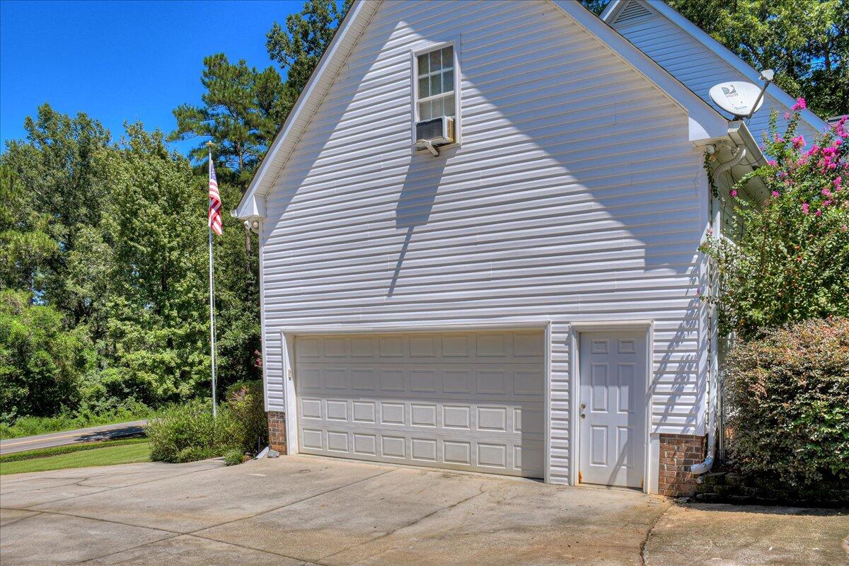 2008 Gregory Lake Road North Augusta, SC 29860 - Photo 34 of 56 Double garage with walk through entry. Extra parking for large RV with 50 amp charging station.