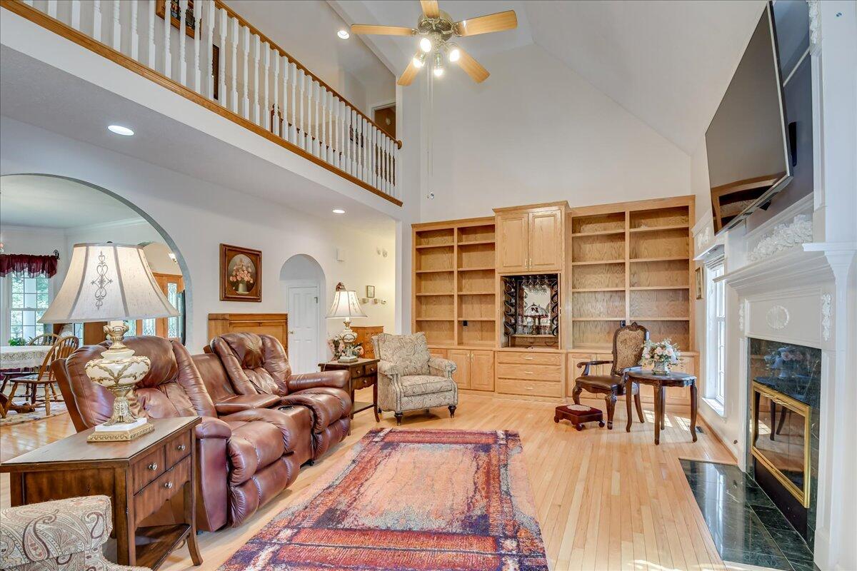 2008 Gregory Lake Road North Augusta, SC 29860 - Photo 6 of 56 Cathedral ceiling, built-in wall of cabinets & book shelves, and a gas log fireplace create the perfect space for relaxing or fun gatherings.