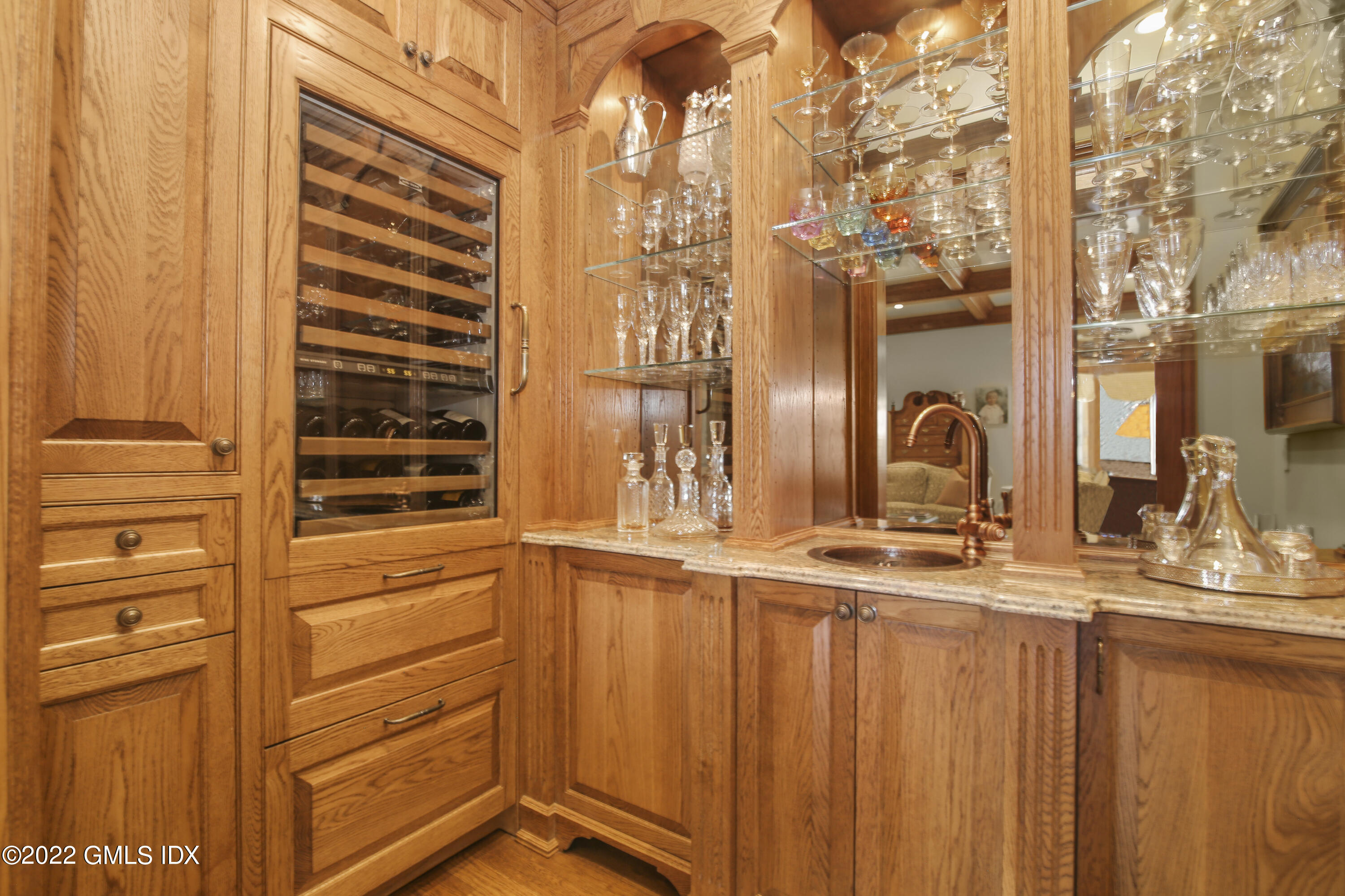 62 Ridge Street Greenwich, CT 06830 - Photo 15 of 40 a bathroom with a double vanity sink and a mirror