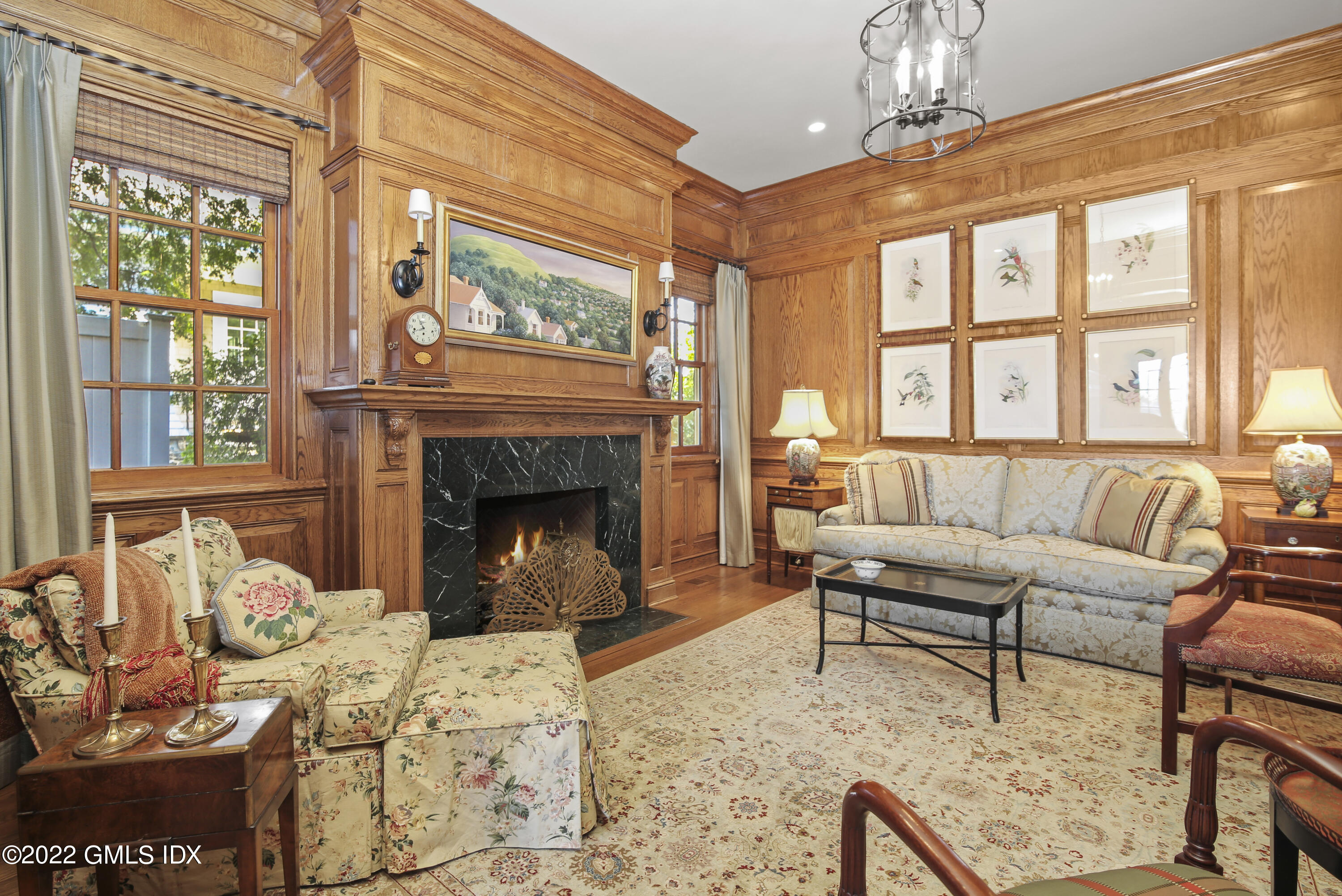 62 Ridge Street Greenwich, CT 06830 - Photo 16 of 40 a living room with furniture and a fireplace