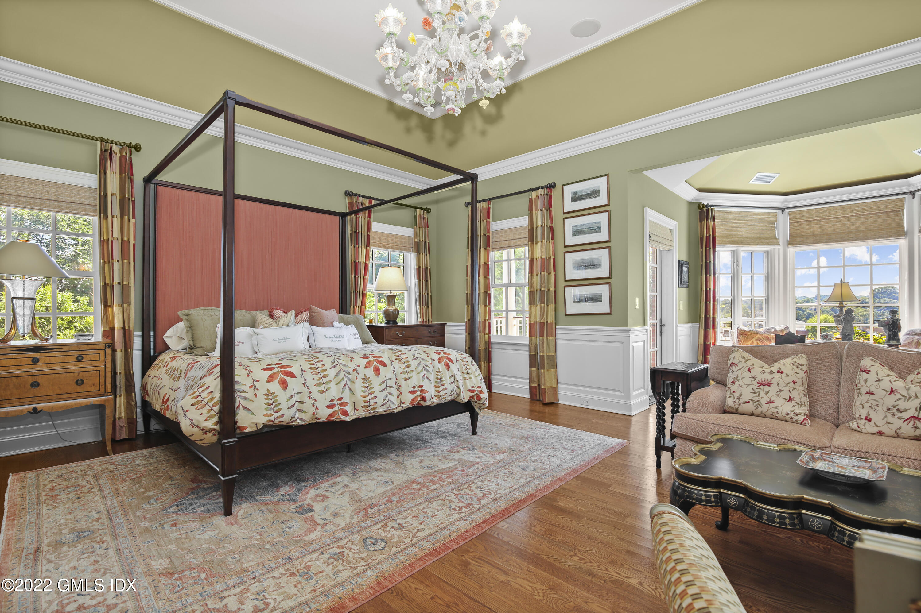 62 Ridge Street Greenwich, CT 06830 - Photo 19 of 40 a bed sitting in a spacious bedroom next to a window