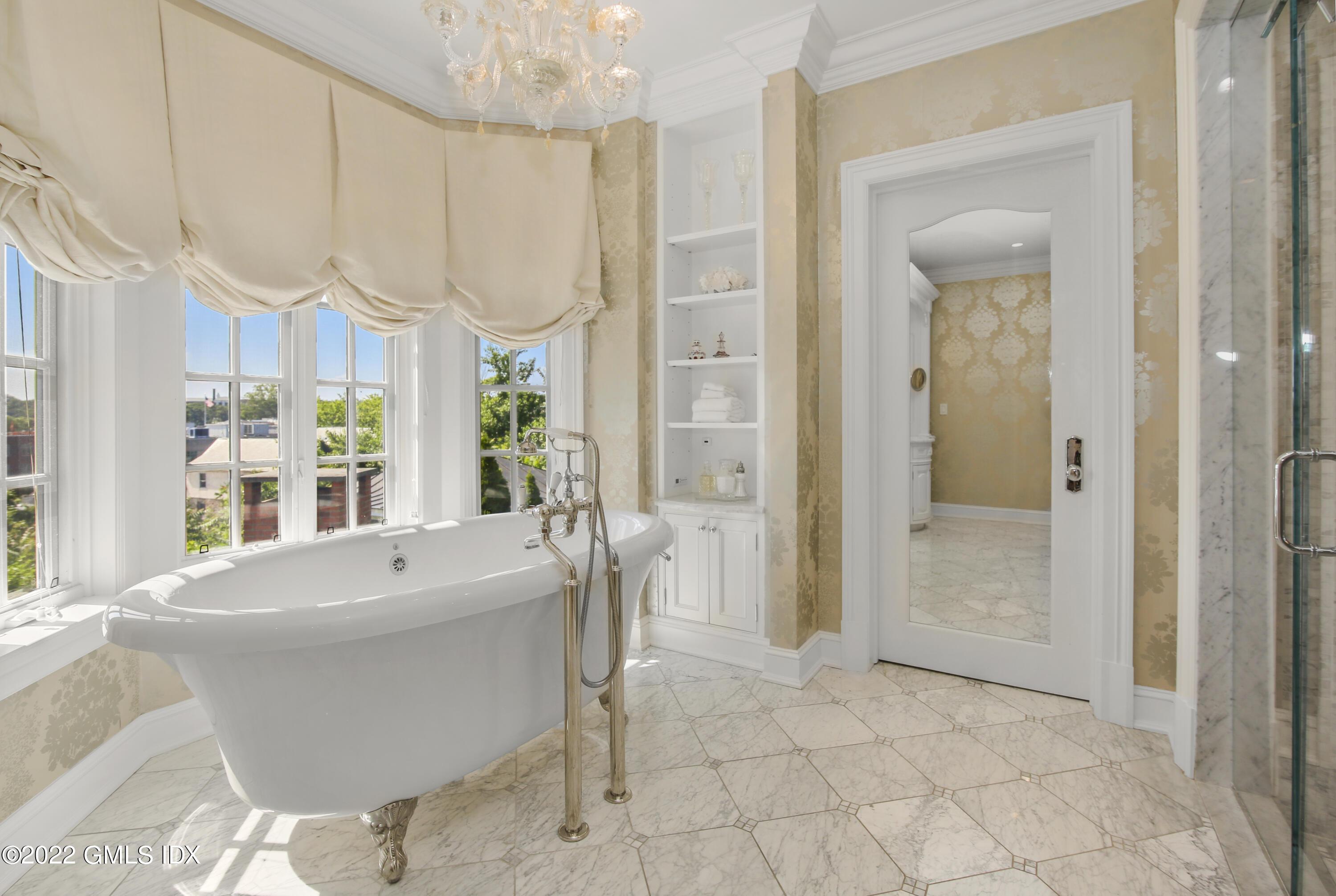 62 Ridge Street Greenwich, CT 06830 - Photo 21 of 40 a very nice looking dining room with a large window and kitchen view