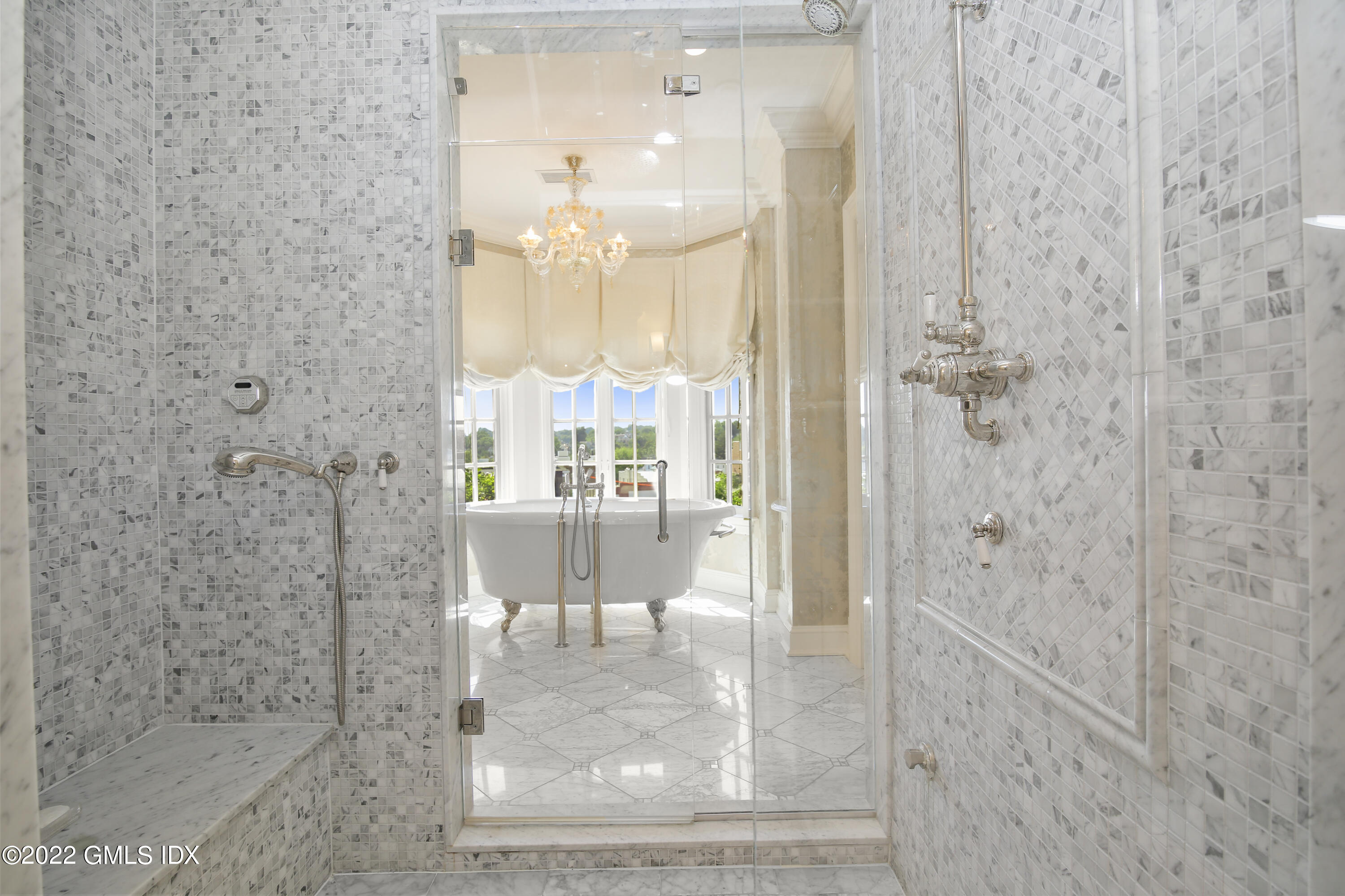 62 Ridge Street Greenwich, CT 06830 - Photo 22 of 40 a bathroom with a glass shower door