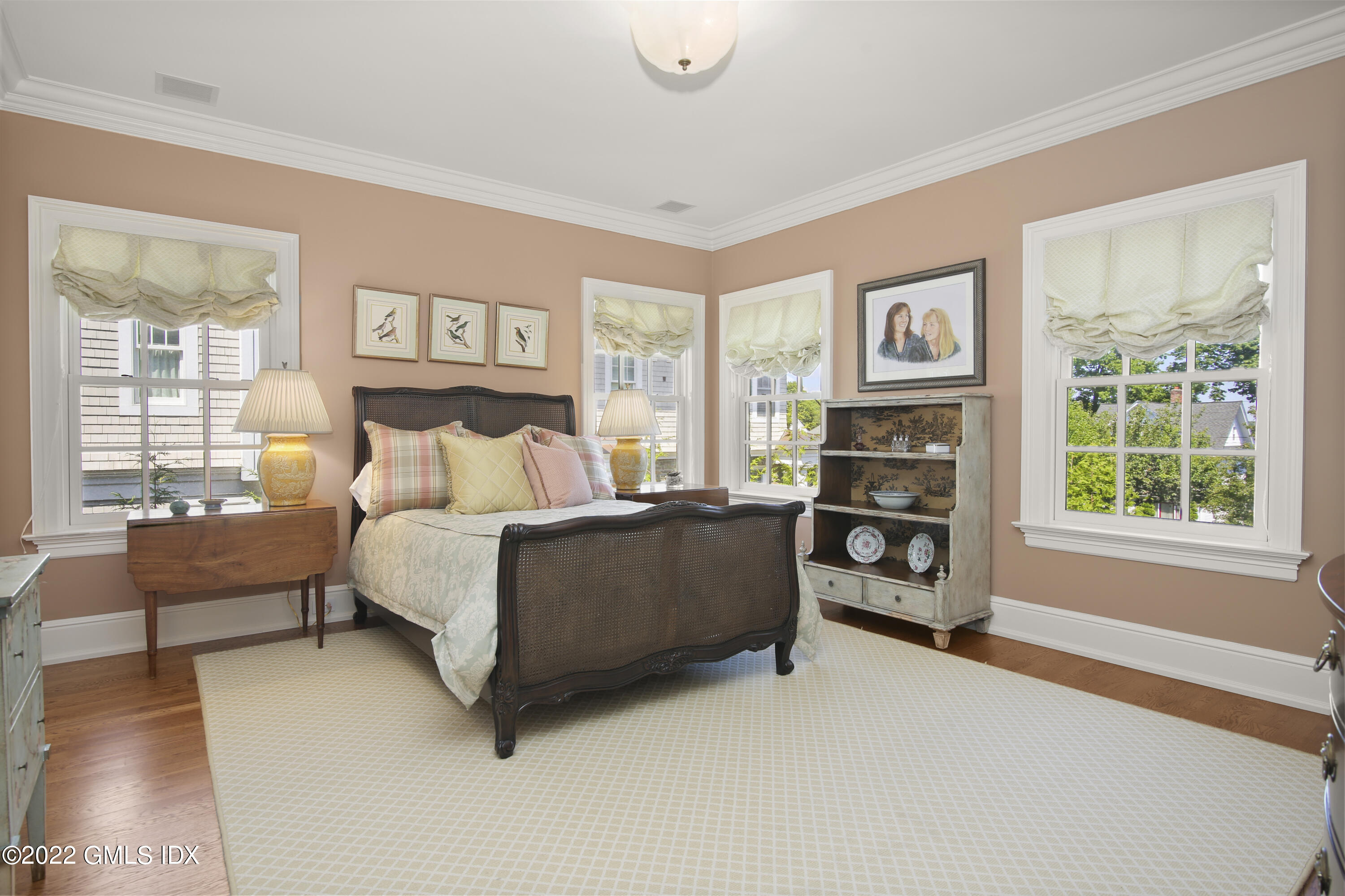 62 Ridge Street Greenwich, CT 06830 - Photo 24 of 40 a bedroom with furniture and a fireplace