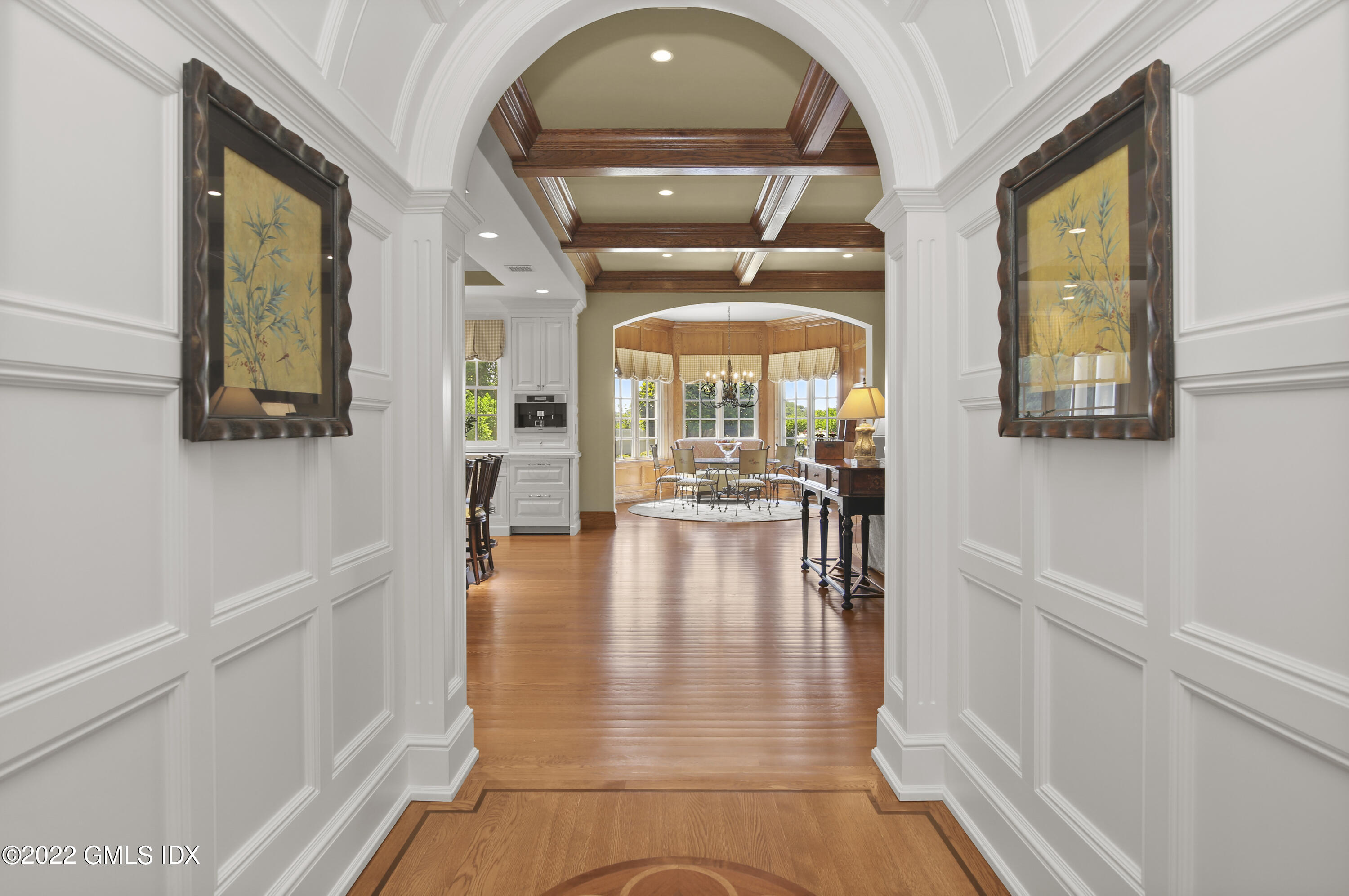 62 Ridge Street Greenwich, CT 06830 - Photo 9 of 40 a view of a hallway with wooden floor and a living room