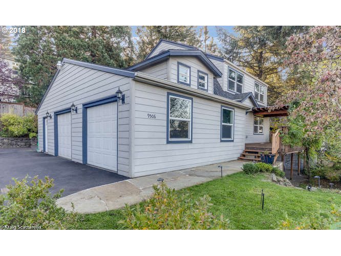 9506 Southwest Boones Ferry Road Portland, OR 97219 - Photo 1 of 32 a view of a house with a yard
