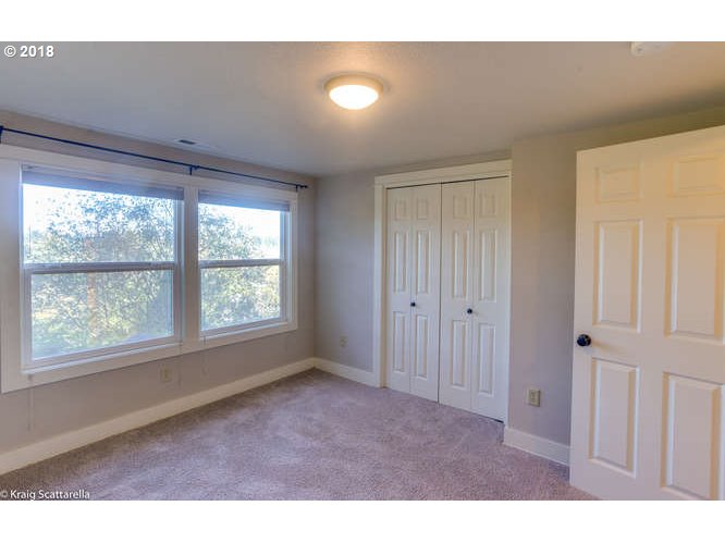 9506 Southwest Boones Ferry Road Portland, OR 97219 - Photo 20 of 32 a big room with windows and closet