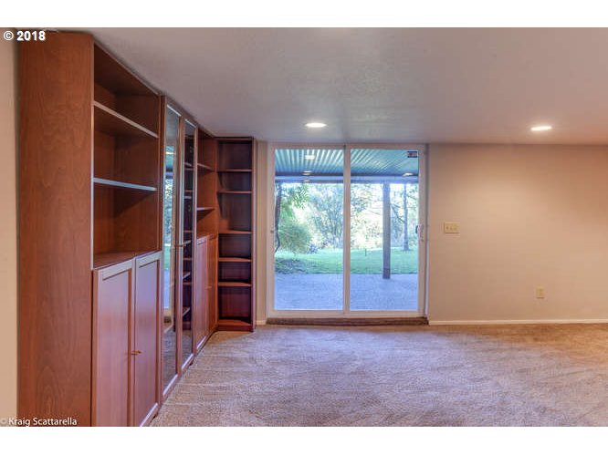 9506 Southwest Boones Ferry Road Portland, OR 97219 - Photo 26 of 32 a view of an empty room with a window