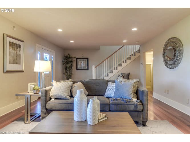 9506 Southwest Boones Ferry Road Portland, OR 97219 - Photo 5 of 32 a living room with furniture and a wooden floor