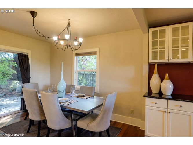 9506 Southwest Boones Ferry Road Portland, OR 97219 - Photo 8 of 32 a view of a dining room with furniture and window