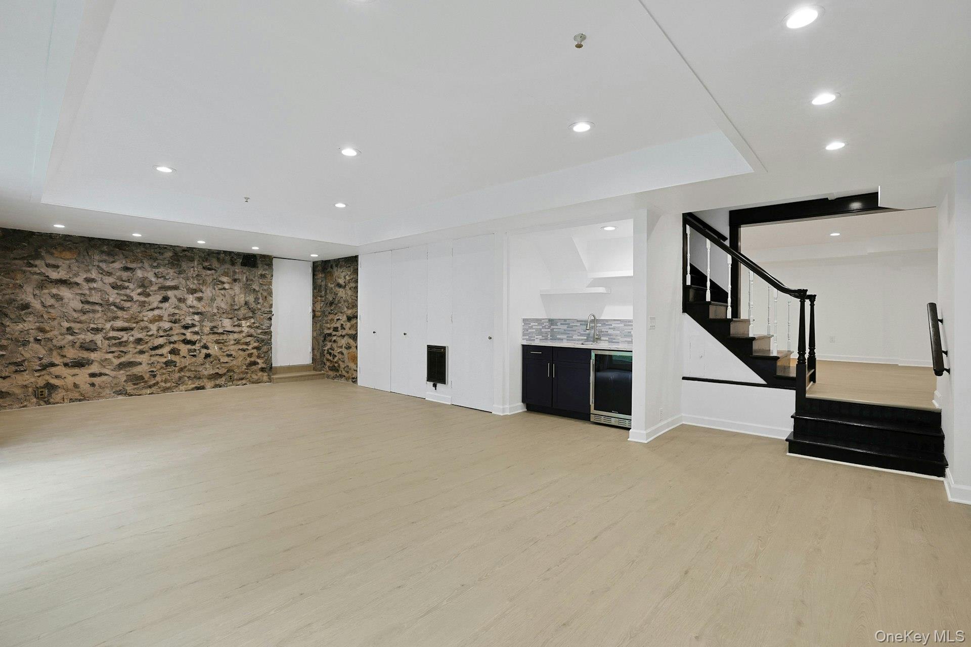 14 Withington Road Scarsdale, NY 10583 - Photo 32 of 41 a view of an empty room with stairs and a window