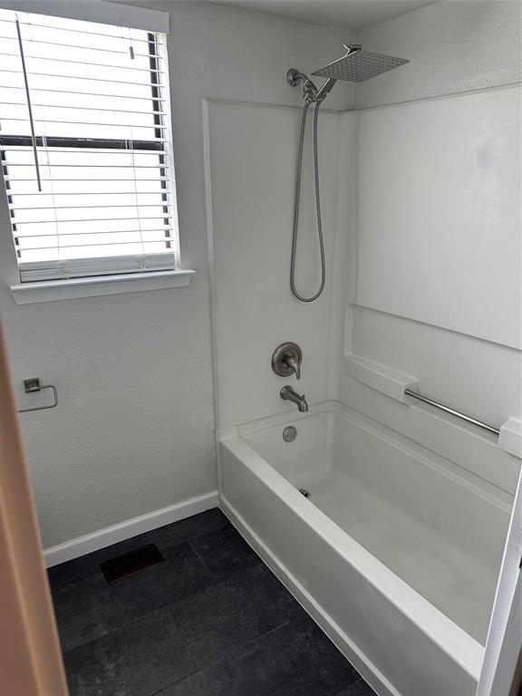 4520 Speedway, Unit A Austin, TX 78751 - Photo 6 of 9 Bathroom with shower / bathtub combination and baseboards
