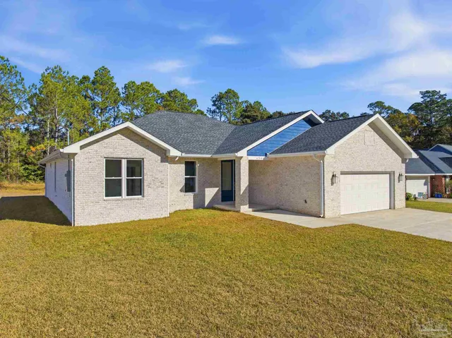 a view of a house with a yard