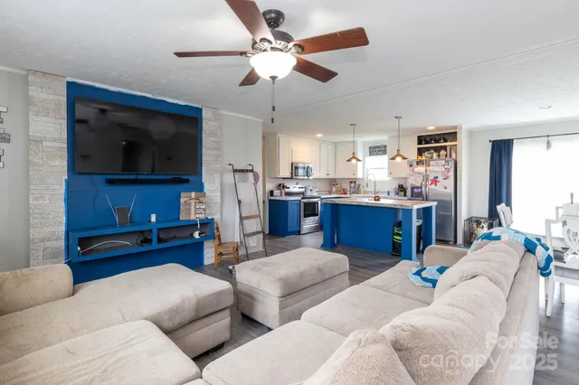 a living room with furniture and a flat screen tv