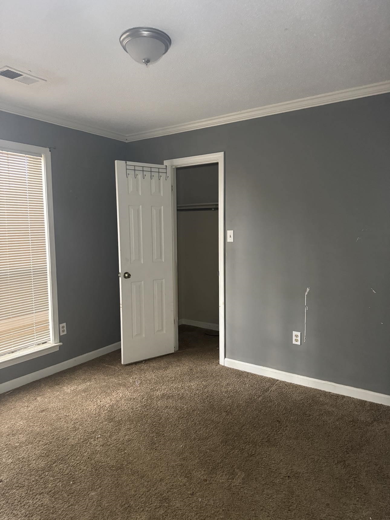 2744 Arbor Ln Drive Memphis, TN 38133 - Photo 7 of 11 an empty room with windows and closet
