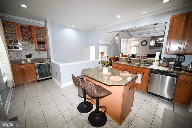a living room with furniture a window and a dining table