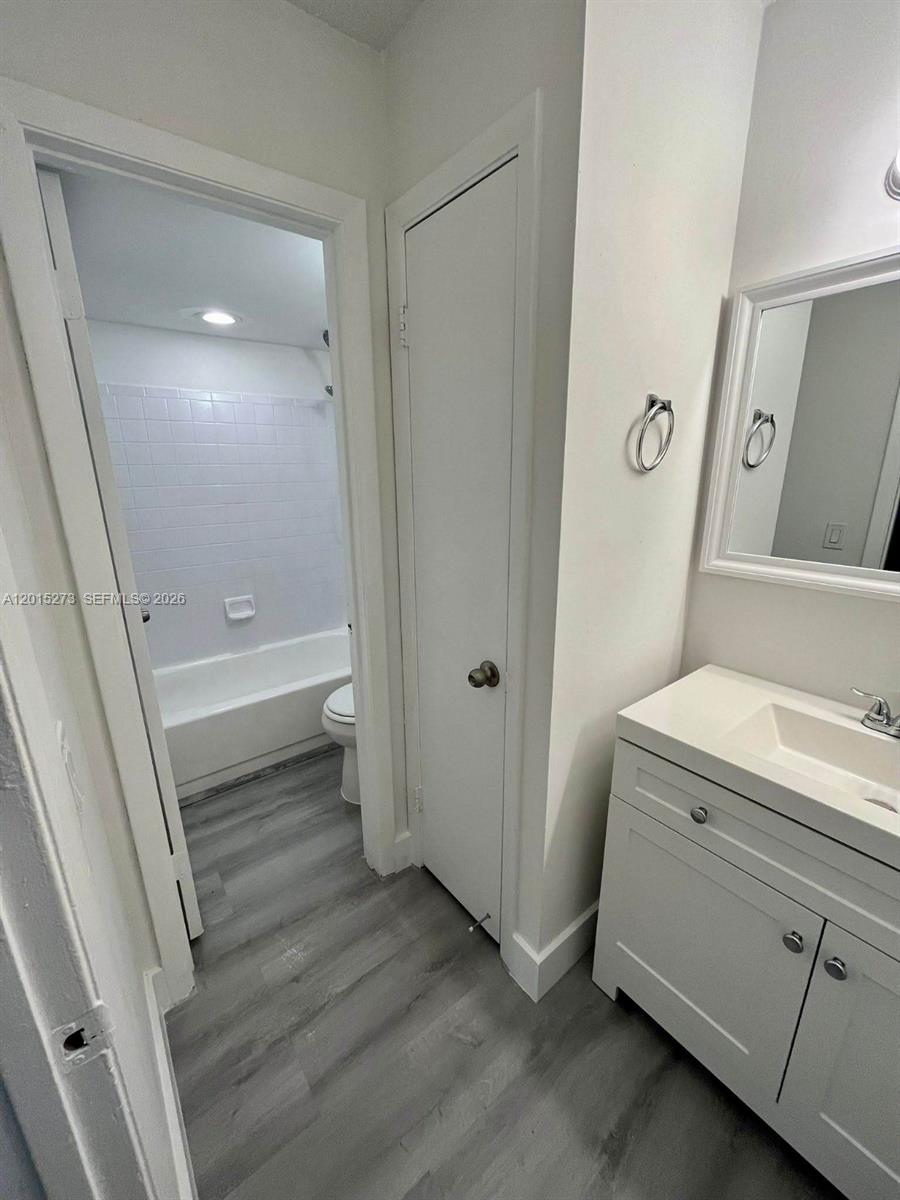 4561 West McNab Road, Unit 17 Pompano Beach, FL 33069 - Photo 11 of 11 a bathroom with a sink and a mirror