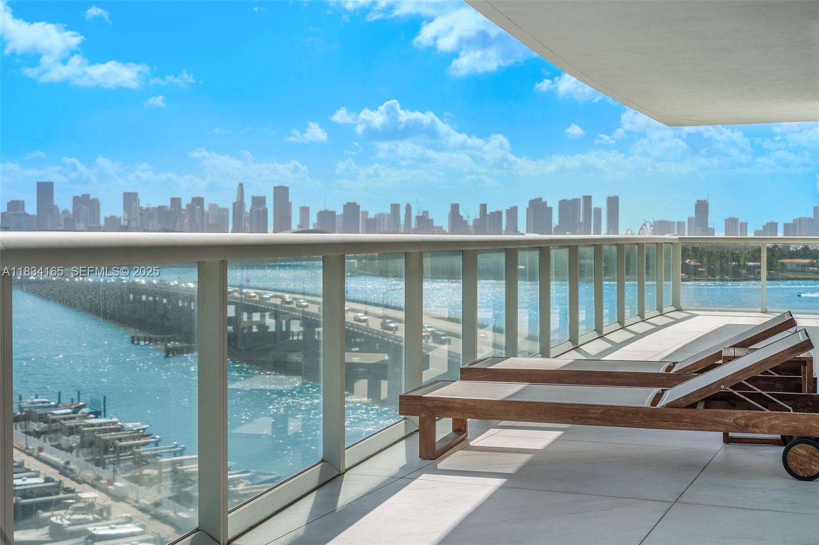 450 Alton Road, Unit 901902 Miami Beach, FL 33139 - Photo 40 of 100 a view of a balcony with lake view and sitting space