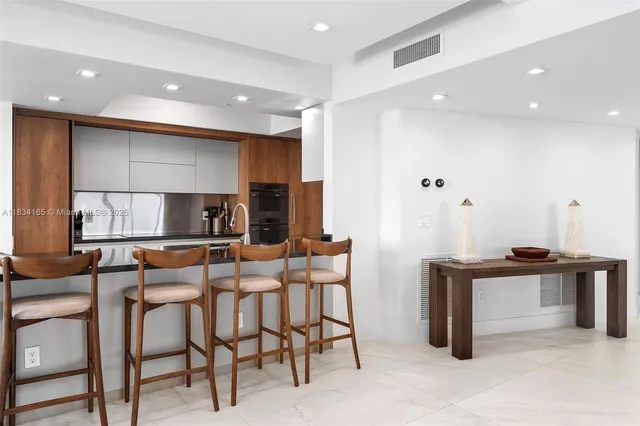 a living room with furniture or couch and a dining table