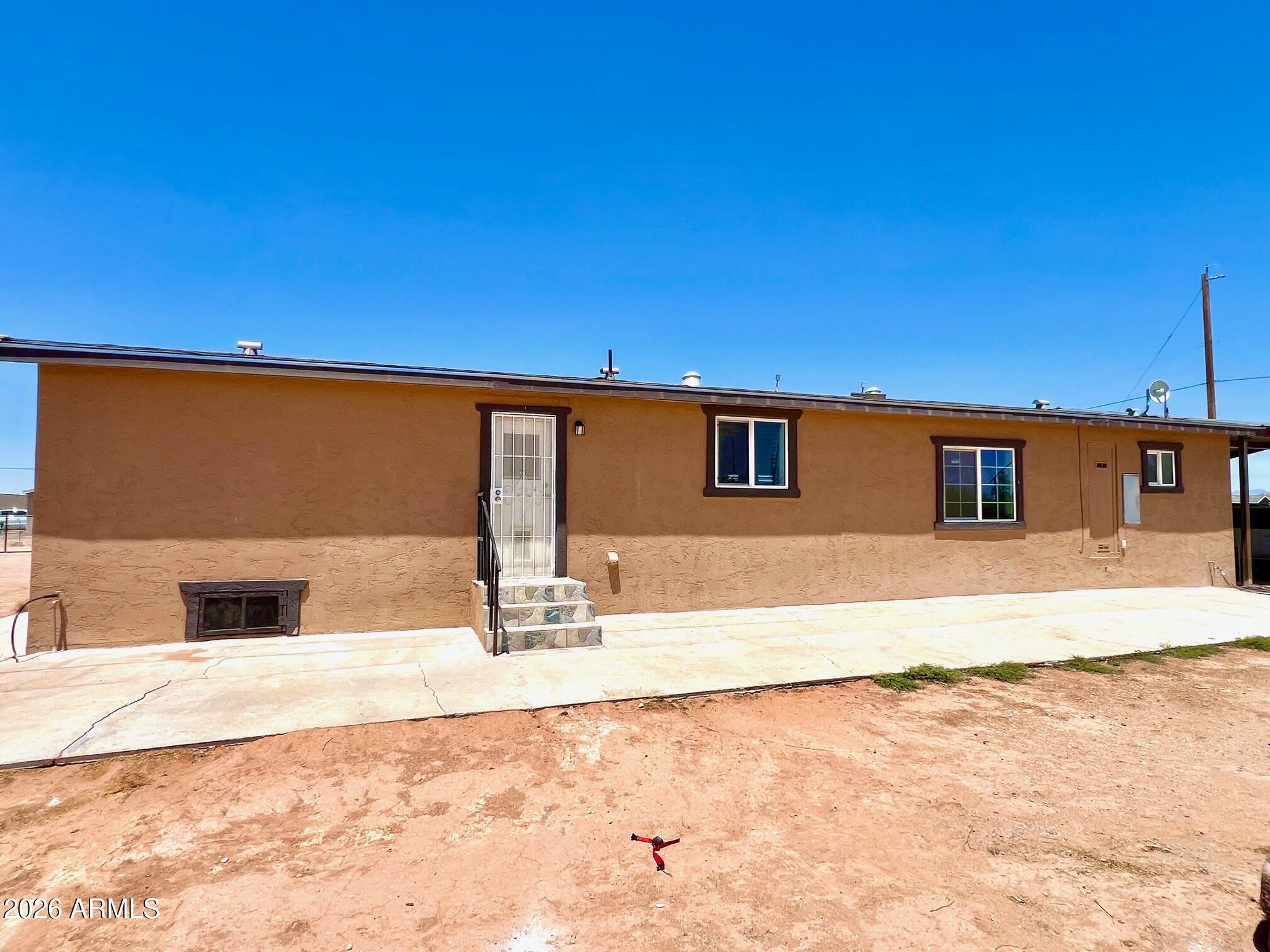 12035 East Tennyson Road Florence, AZ 85132 - Photo 8 of 42 a view of a house with a outdoor space