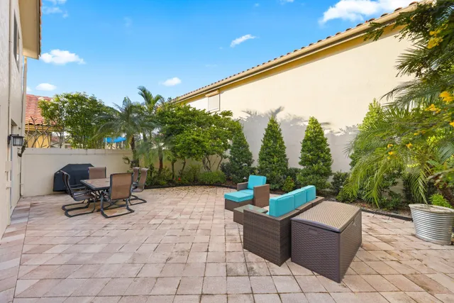 a view of a terrace with chairs and a couch