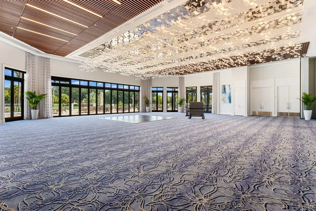 a view of an ocean with a floor to ceiling window