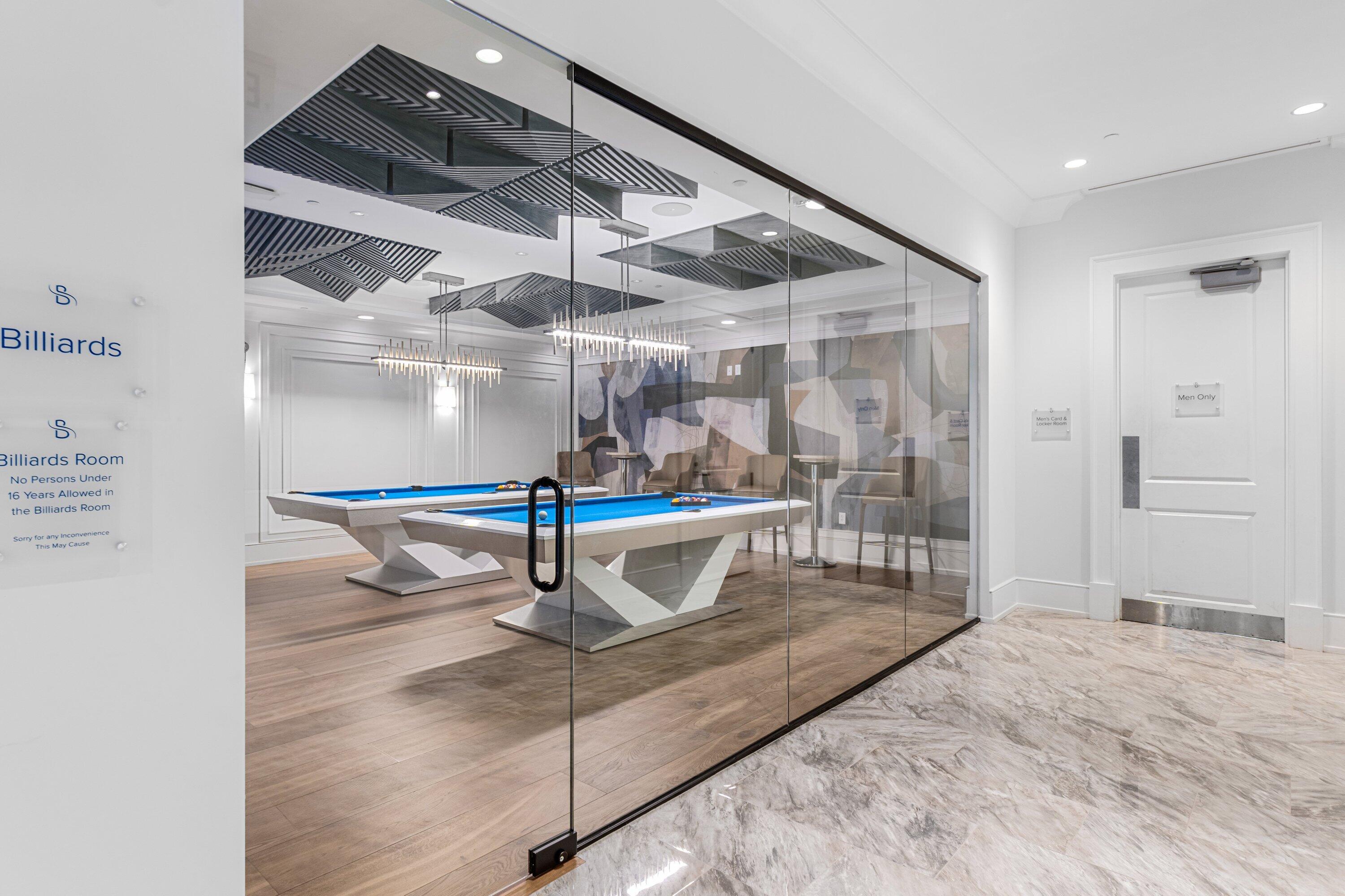 2595 Northwest 53rd Street Boca Raton, FL 33496 - Photo 35 of 48 a room with wooden floor and white walls