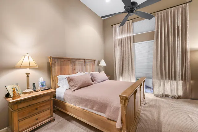 a bedroom with a bed and a lamp with the outer view