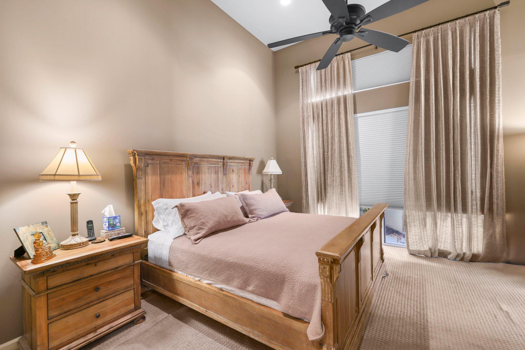 2595 Northwest 53rd Street Boca Raton, FL 33496 - Photo 10 of 48 a bedroom with a bed and a lamp with the outer view