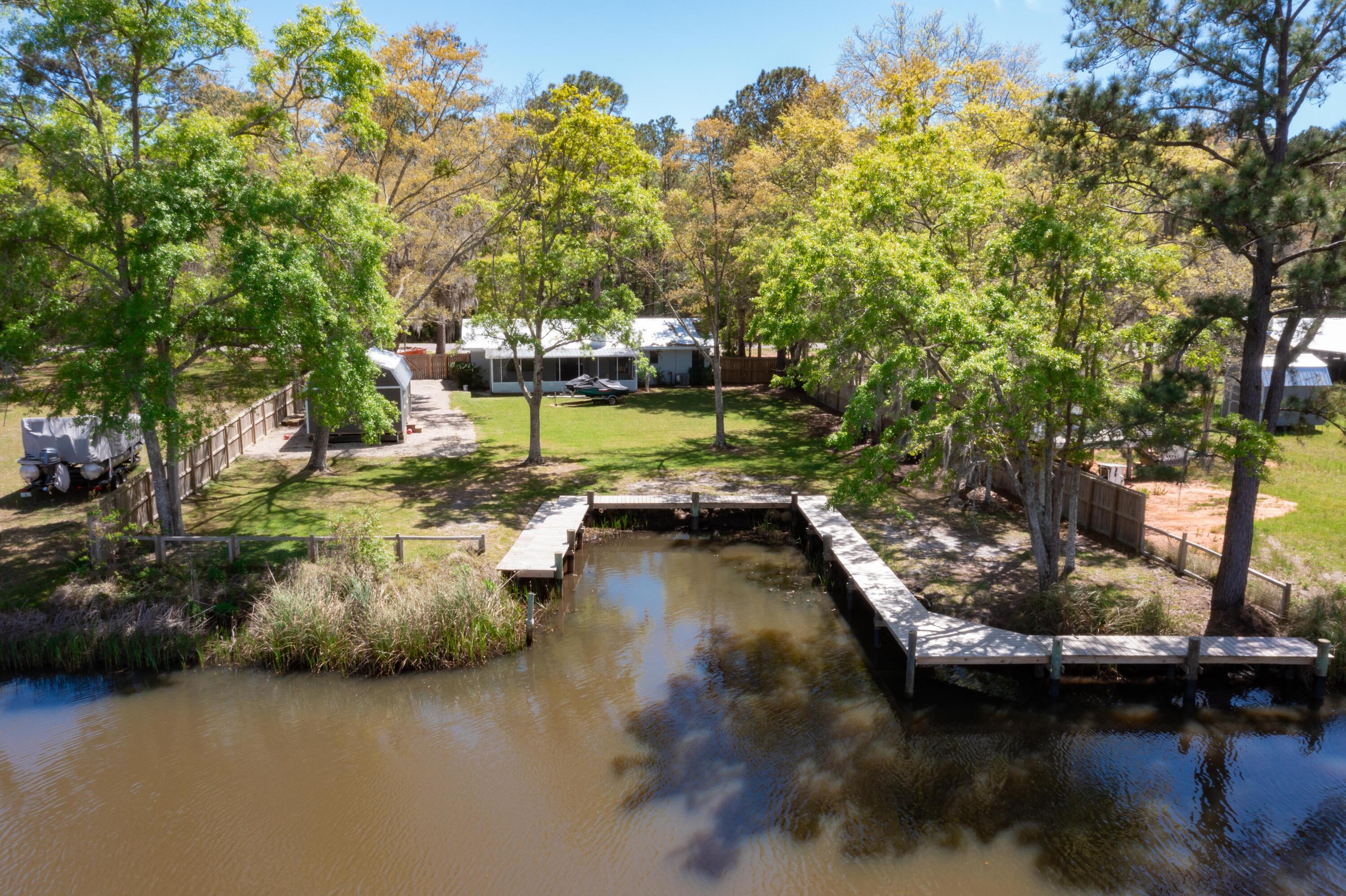 1534 Bay Grove Road Freeport, FL 32439 - Photo 1 of 33 a view of a lake with houses