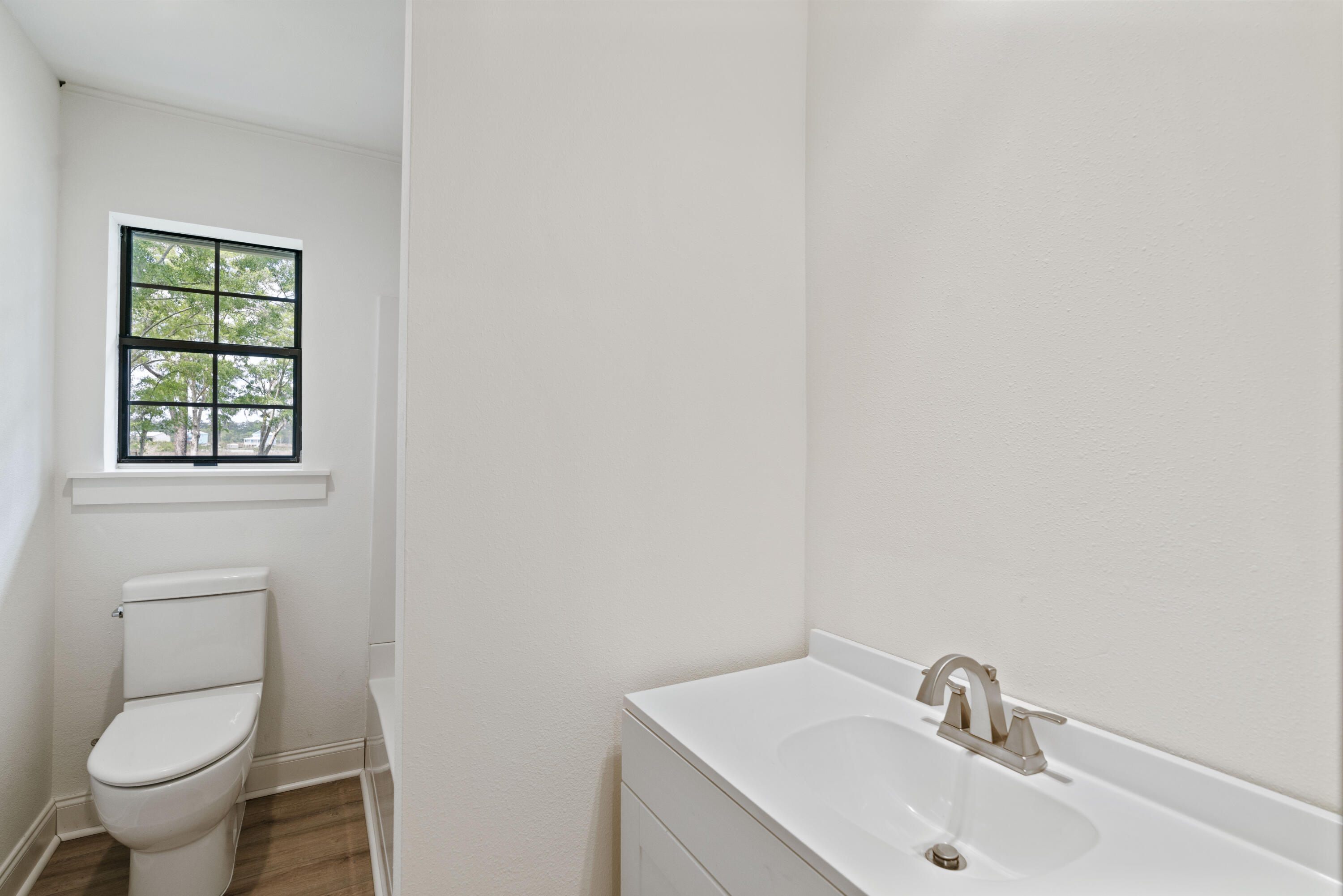 1534 Bay Grove Road Freeport, FL 32439 - Photo 16 of 33 a bathroom with a sink and a toilet