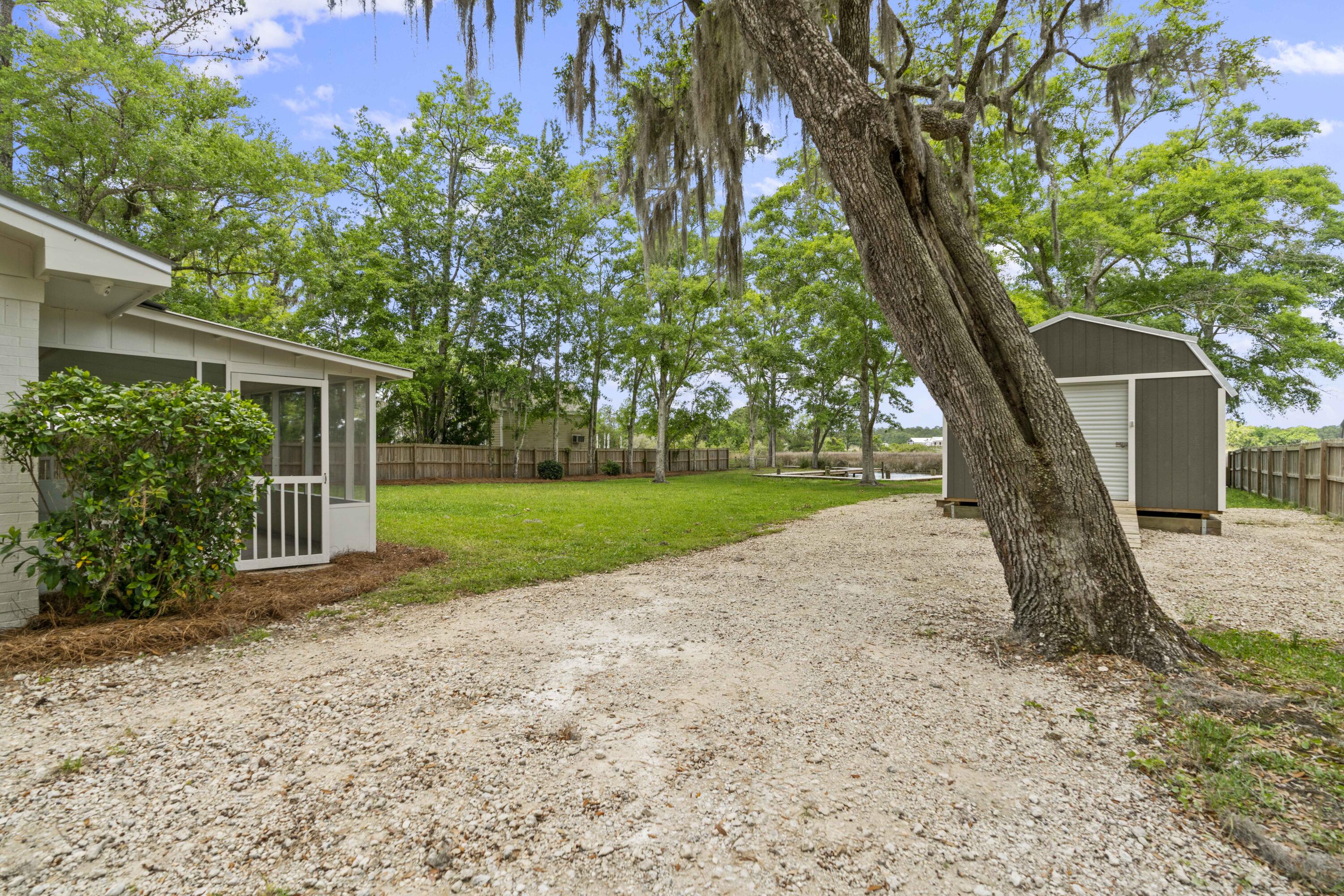 1534 Bay Grove Road Freeport, FL 32439 - Photo 20 of 33 a view of a backyard with a tree