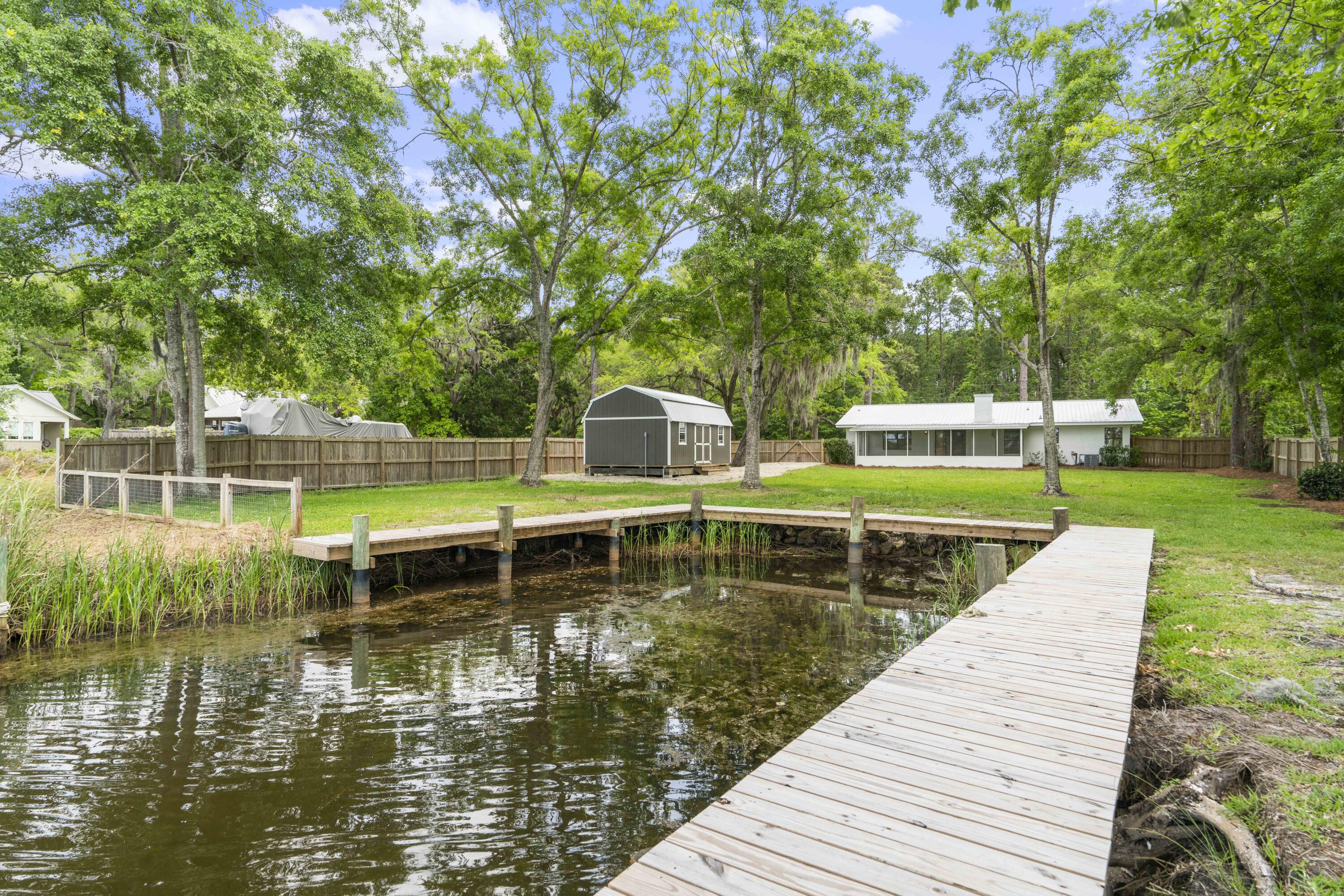 1534 Bay Grove Road Freeport, FL 32439 - Photo 25 of 33 swimming pool view with a lake view