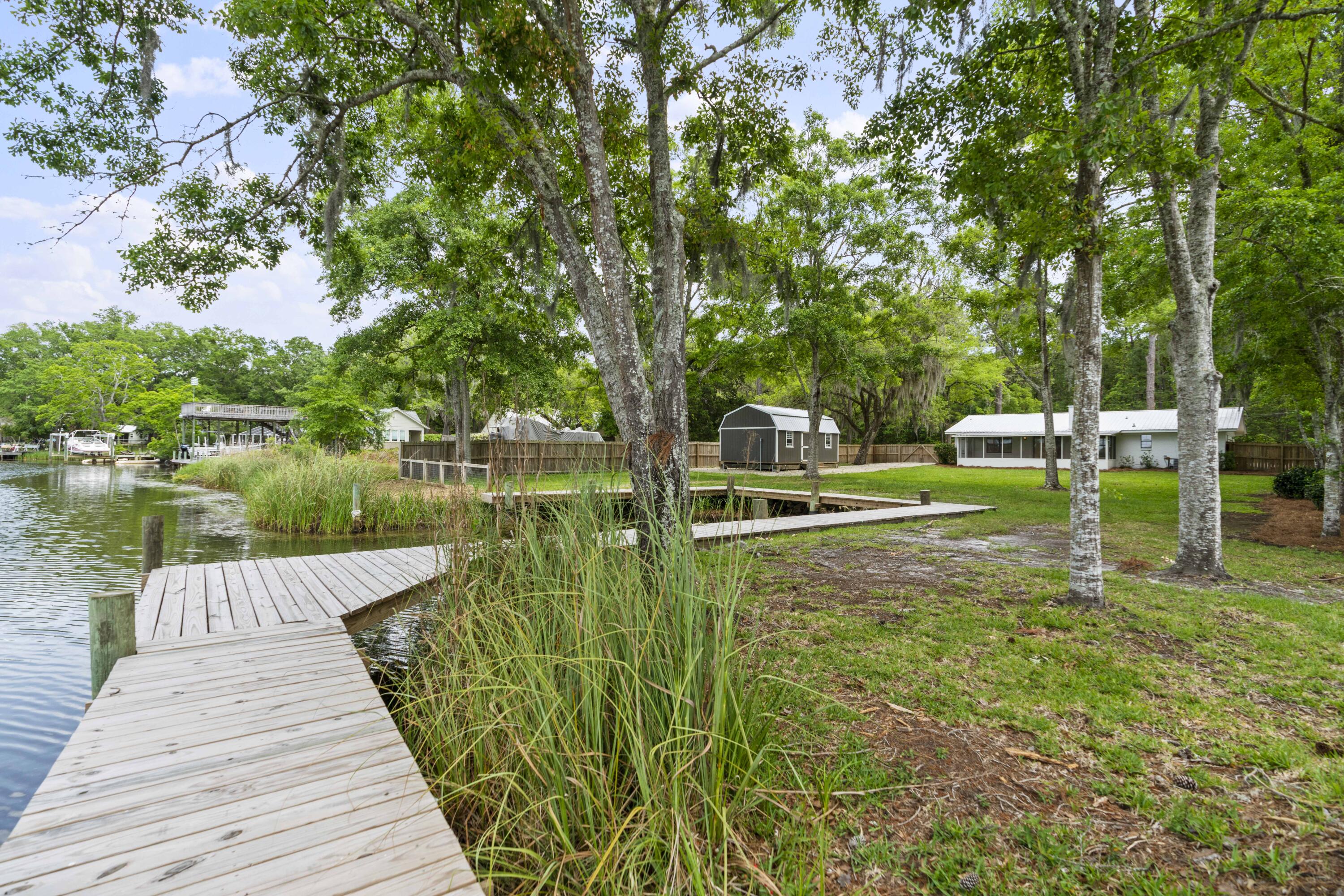 1534 Bay Grove Road Freeport, FL 32439 - Photo 26 of 33 a view of a lake with large trees